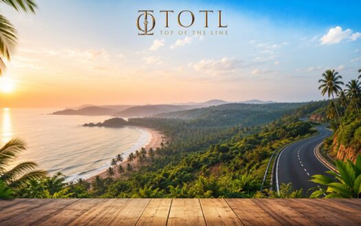 A scenic panoramic view of the pristine coastline of the MahaGoa Region, featuring turquoise Arabian Sea waters, golden sandy beaches, lush green hills, winding coastal roads, and vibrant tropical landscapes. The image symbolizes the region's growing tourism, enhanced connectivity, and long-term coastal investment potential driven by infrastructure development and sustainable tourism.