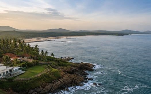 Sindhudurg real estate landscape with scenic coastline, lush greenery and coastal development