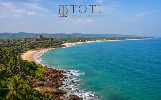 A panoramic aerial view of Sindhudurg's Konkan coastline showcasing pristine beaches, turquoise Arabian Sea, lush greenery, and coastal landscape representing Sindhudurg Real Estate Investment and long-term property opportunities in Maharashtra.