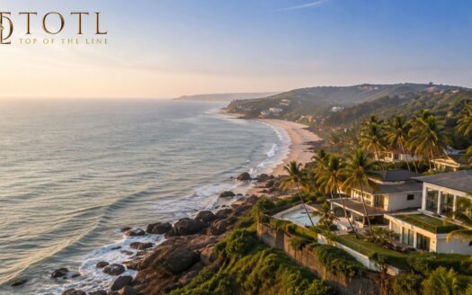 Realistic North Goa coastal landscape with luxury villas, palm trees and beach representing North Goa real estate investment and year-round tourism growth.
