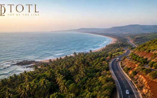 Aerial view of a scenic coastal landscape representing the Sindhudurg–North Goa investment corridor with highway, beaches, greenery and hills